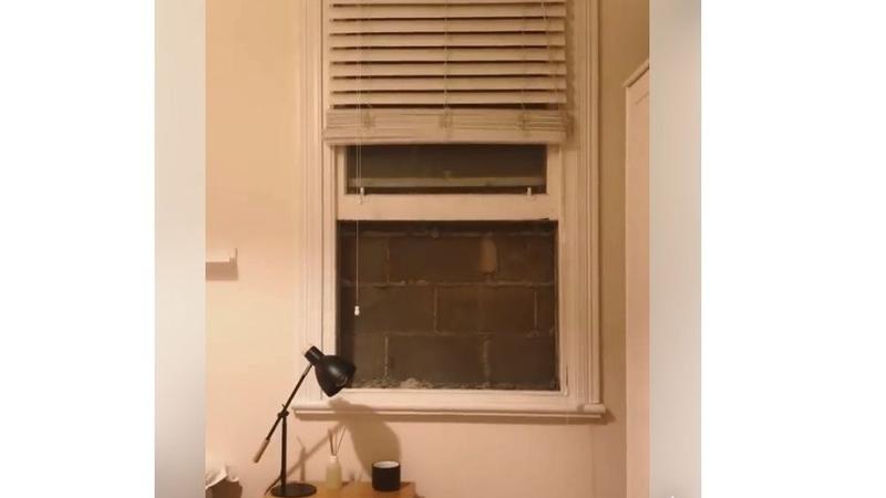 墨尔本房客猛烈抨击“非法”墙只阻挡窗户